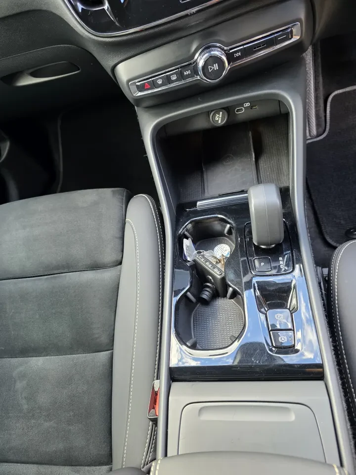 The same Volvo XC40 centre console after the valet, clean.
