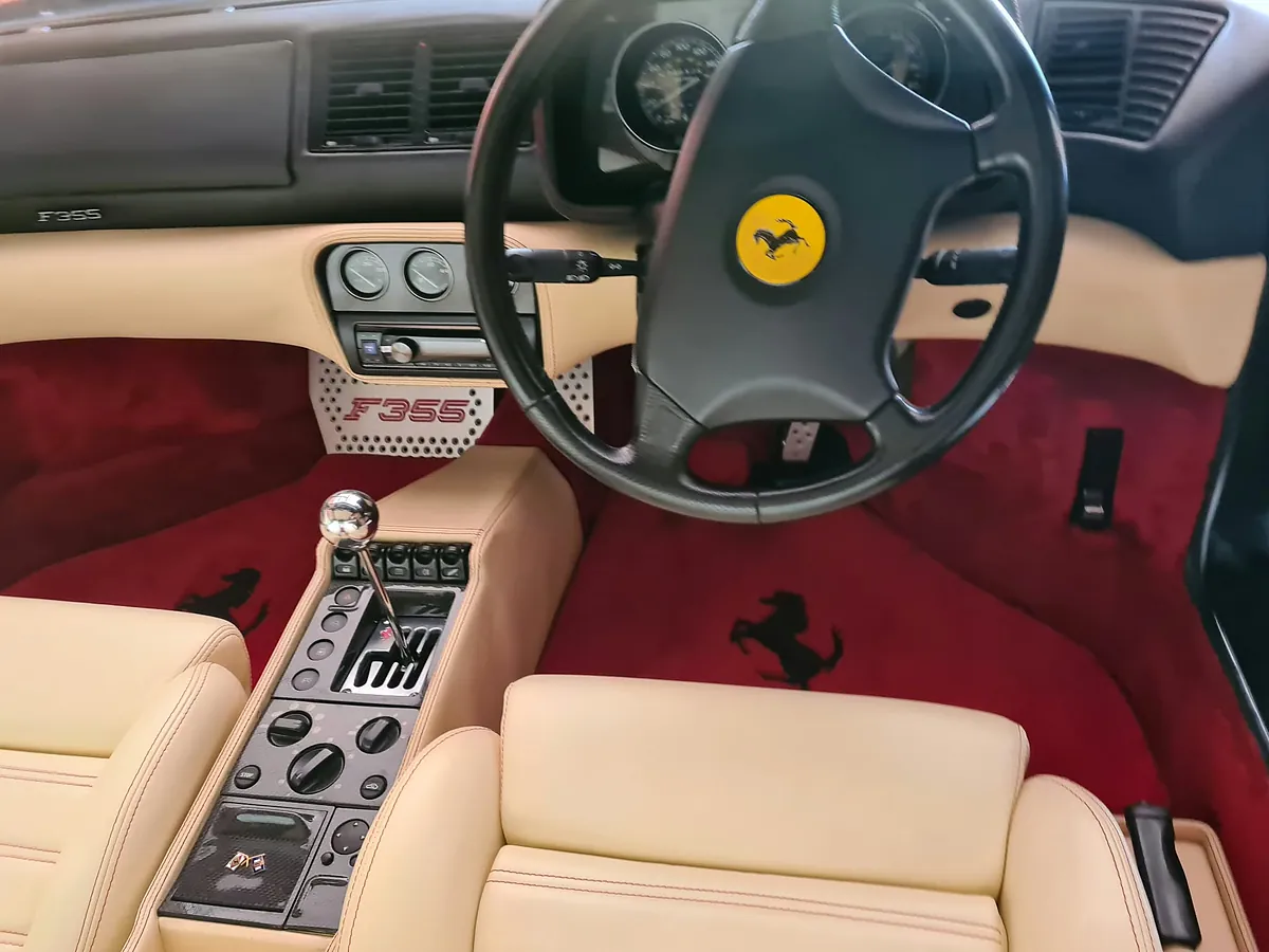 Ferrari F355 interior with cream leather seats, freshly cleaned.