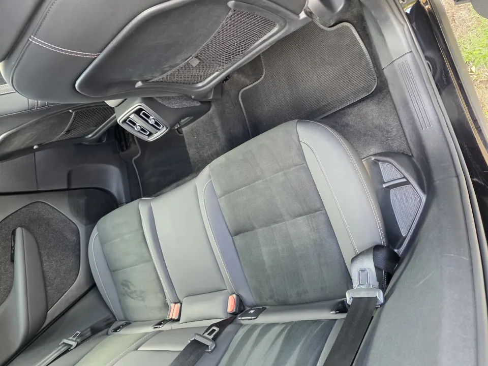 The rear seats of a black Volvo XC40 after an interior valet.
